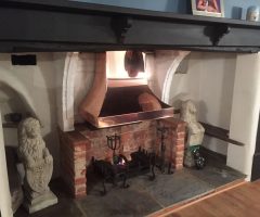 Bespoke inglenook copper canopy and fire grate